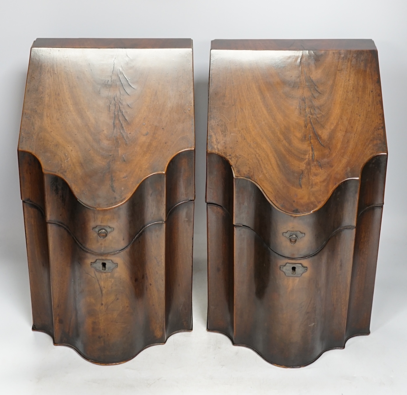 A pair of George III mahogany knife boxes, 37cm tall. Condition - poor to fair